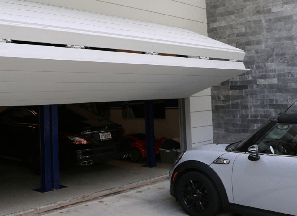 Residential Bi-Fold Hangar Door System by WELL BILT Industries
